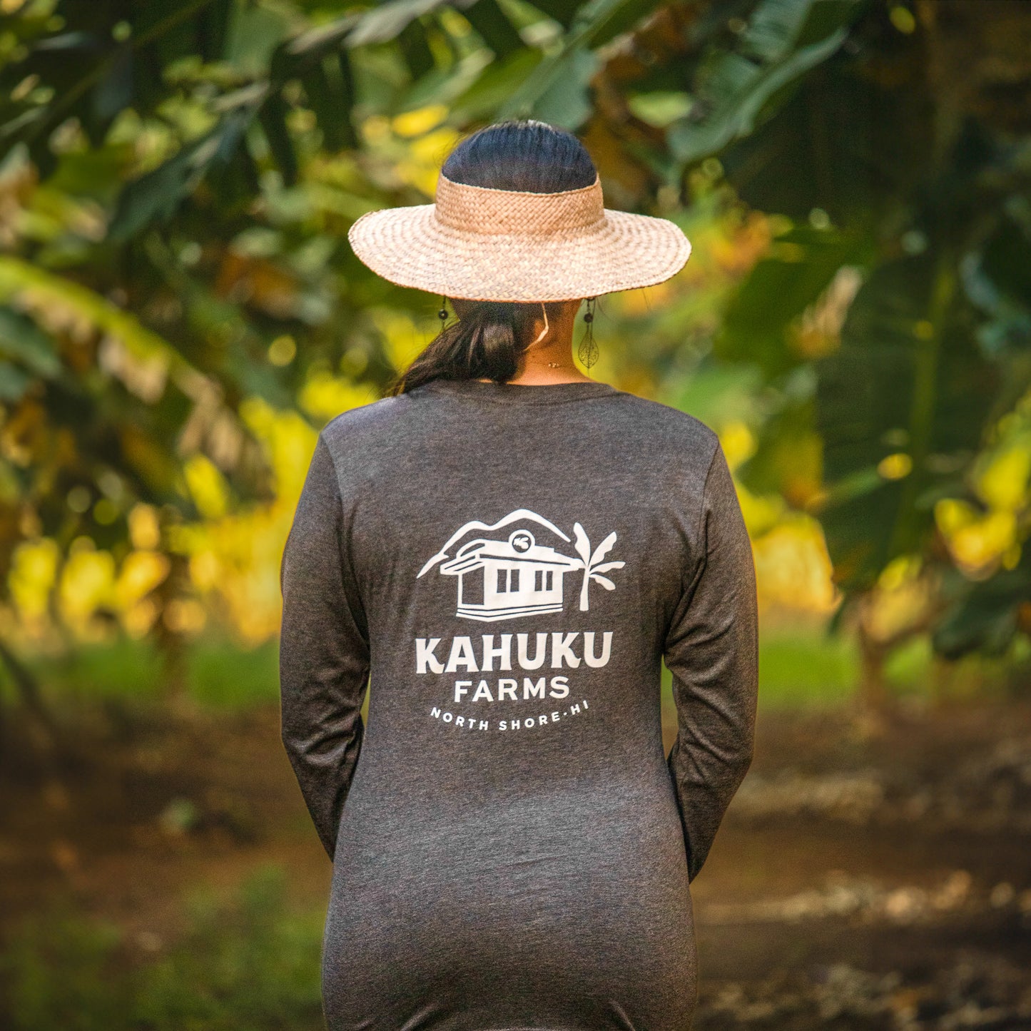 woman modeling back of charcoal grey kahuku farms long sleeve shirt