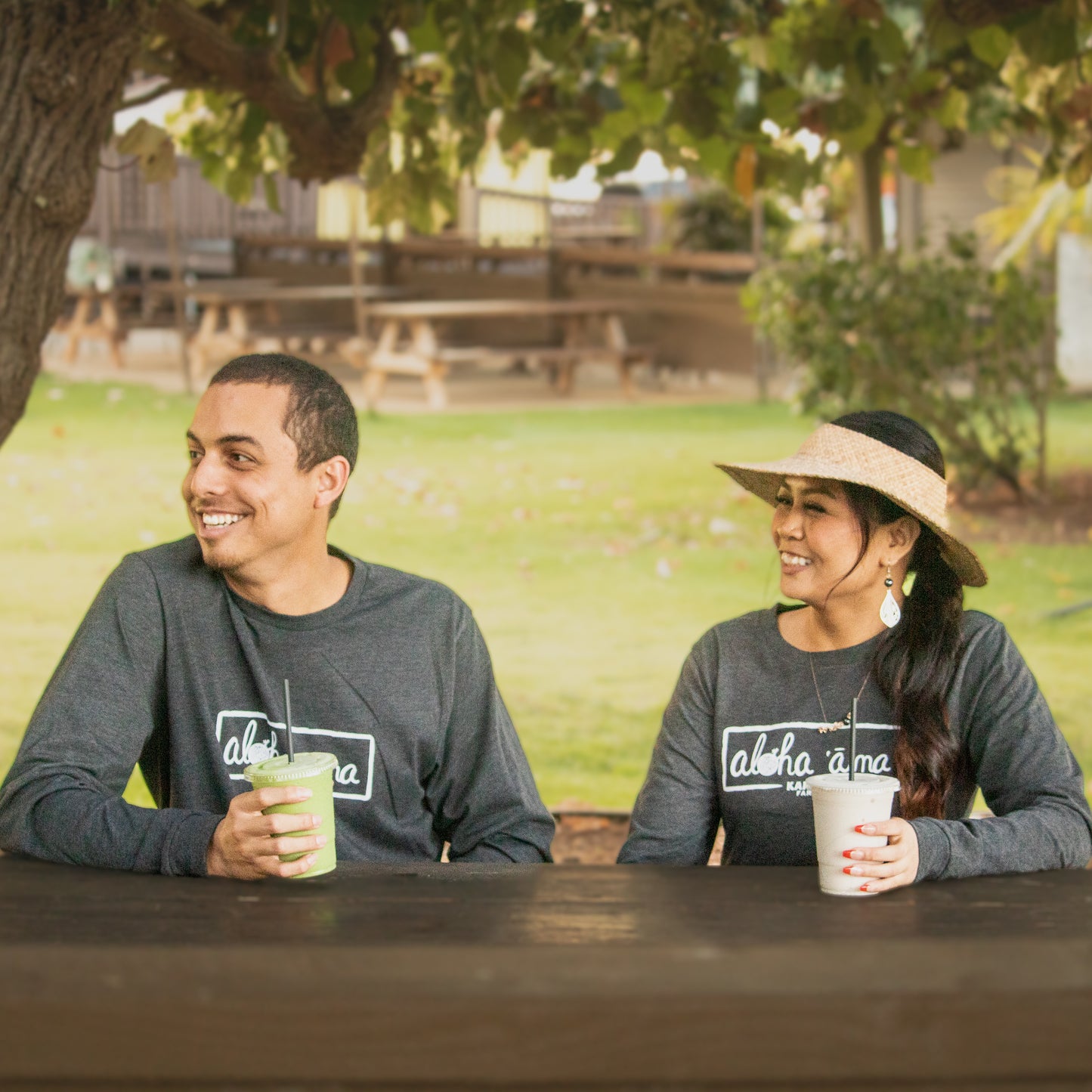 man and woman modeling charcoal grey kahuku farms long sleeve shirt