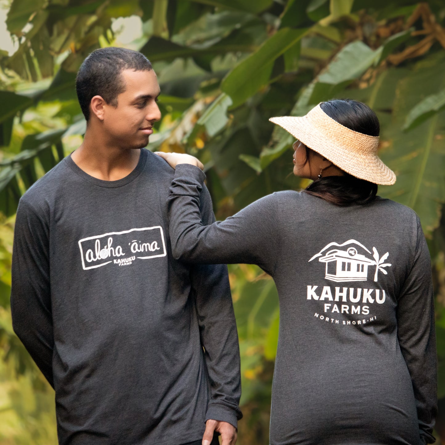 man and woman modeling charcoal grey kahuku farms long sleeve shirt